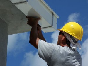 Inspector Tries to Identify Gutter Problems to Answer the Question "How Much is a Home Inspection"